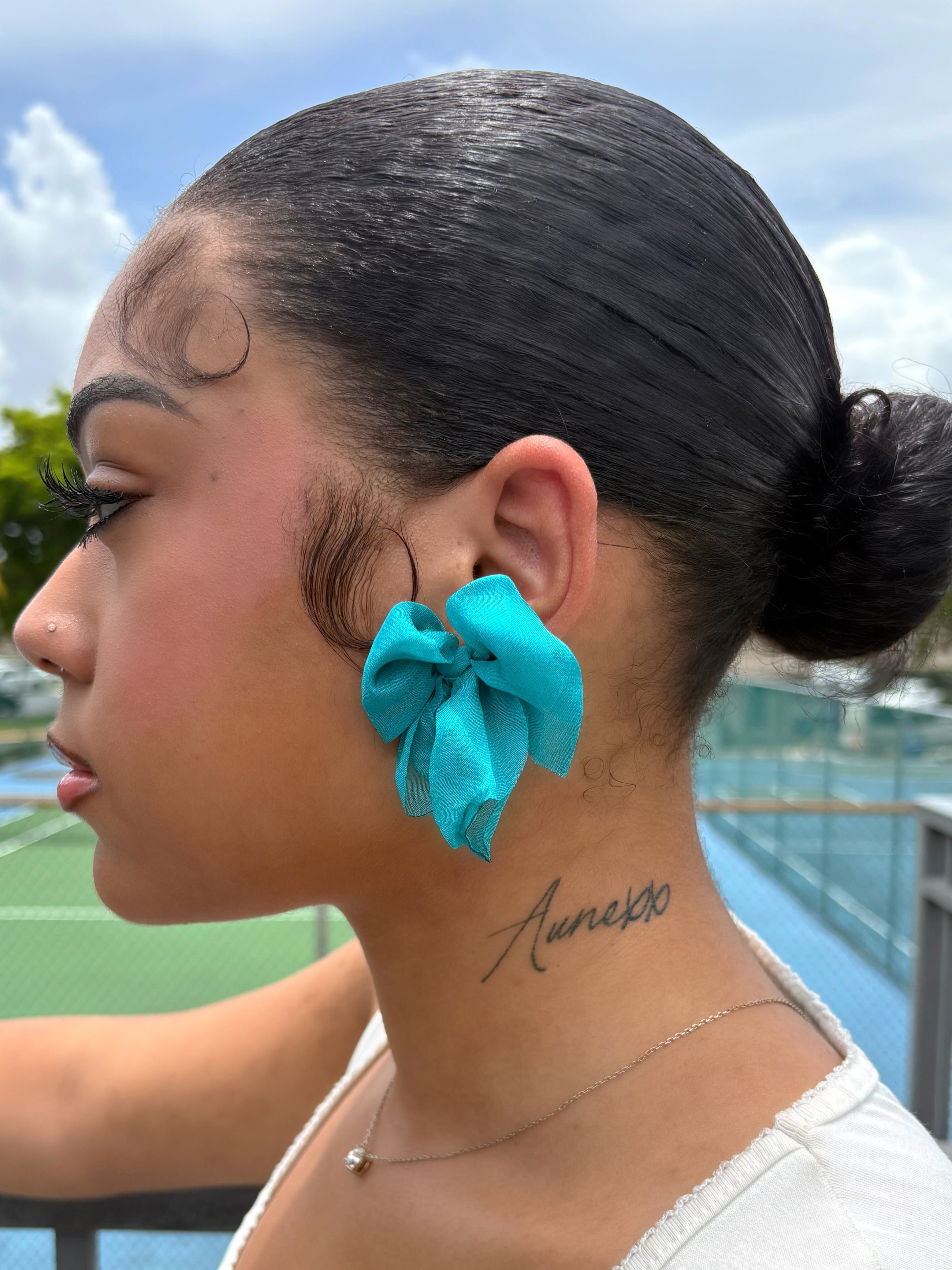 Teal bow earrings